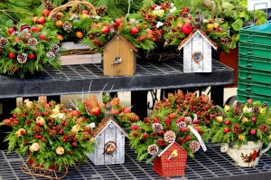 Holiday decorated birdhouses and handmade live evergreen decorations Hand-made live christmas wreaths at Homestead Garden Center, Williamsburg